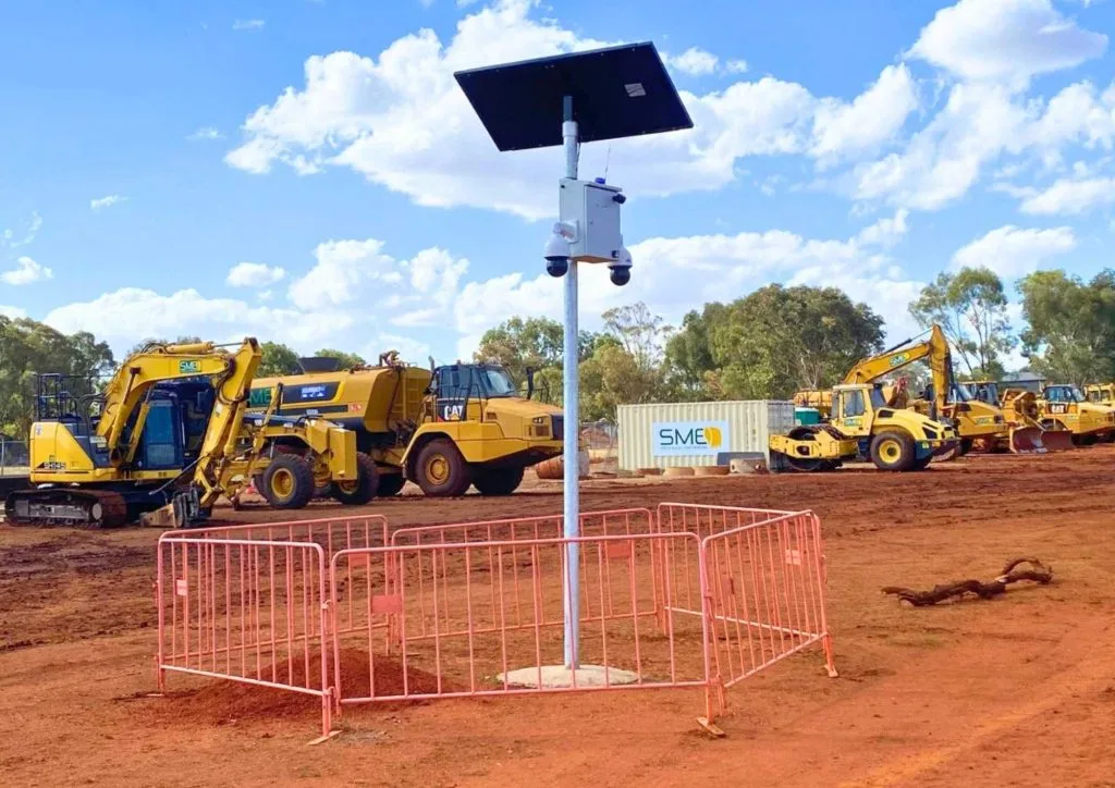 Solar CCTV camera on construction site with heavy machinery