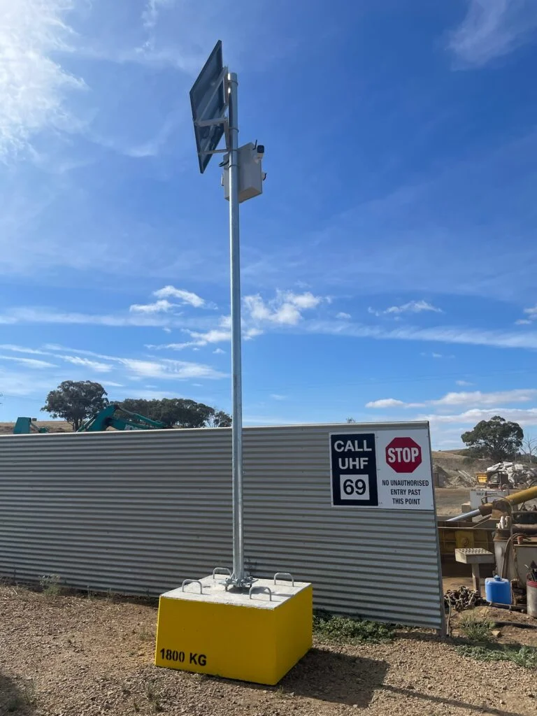 Solar CCTV pole on construction site with base