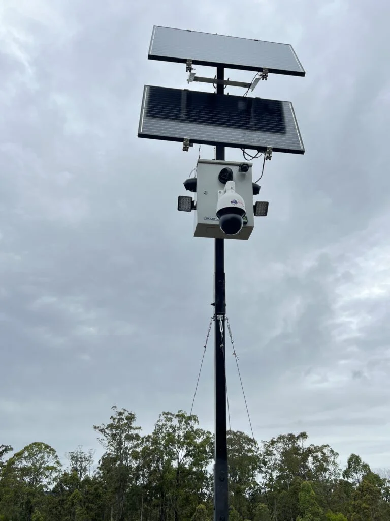 Solar CCTV with dual panels on tall black pole